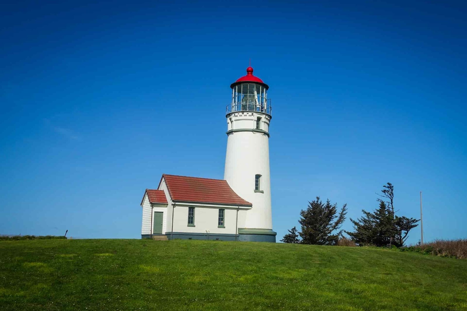lighthouse in Cape Blanco State Park on a sunny day