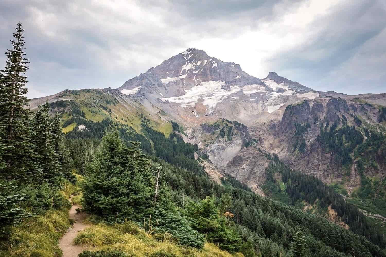 southwest view of mt. hood showing the undulating ridges and rock feature that surround the peak.