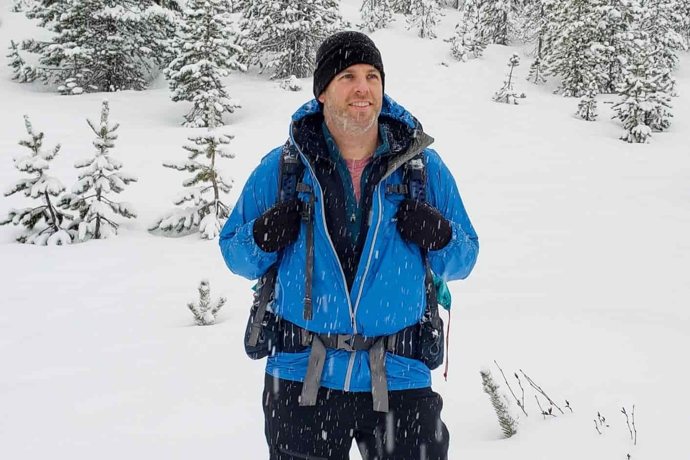 Closeup of a hikers clothing layered for winter hiking and camping.