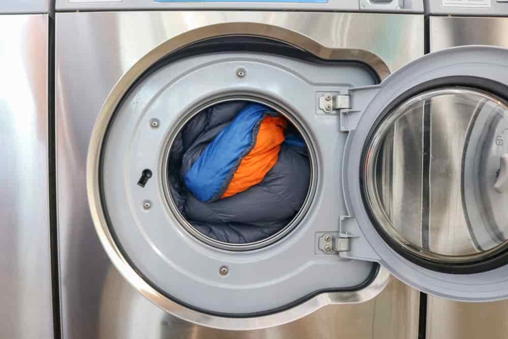 A down sleeping bag inside of a front-loading washing machine