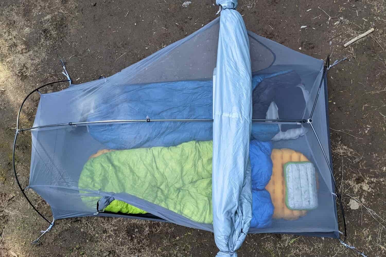 a top-down view of the sea to summit telos backpacking tent with the rainfly rolled and stashed while it isn't raining but can quickly be unrolled should weather roll in.