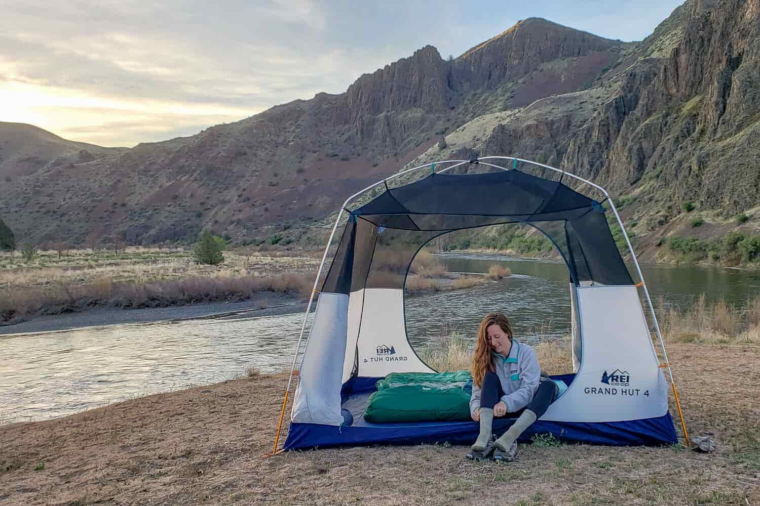 The REI Grand Hut 4 is one of our favorite camping tents because it’s easy to set up, tall enough to stand in, and hold up well to bad weather