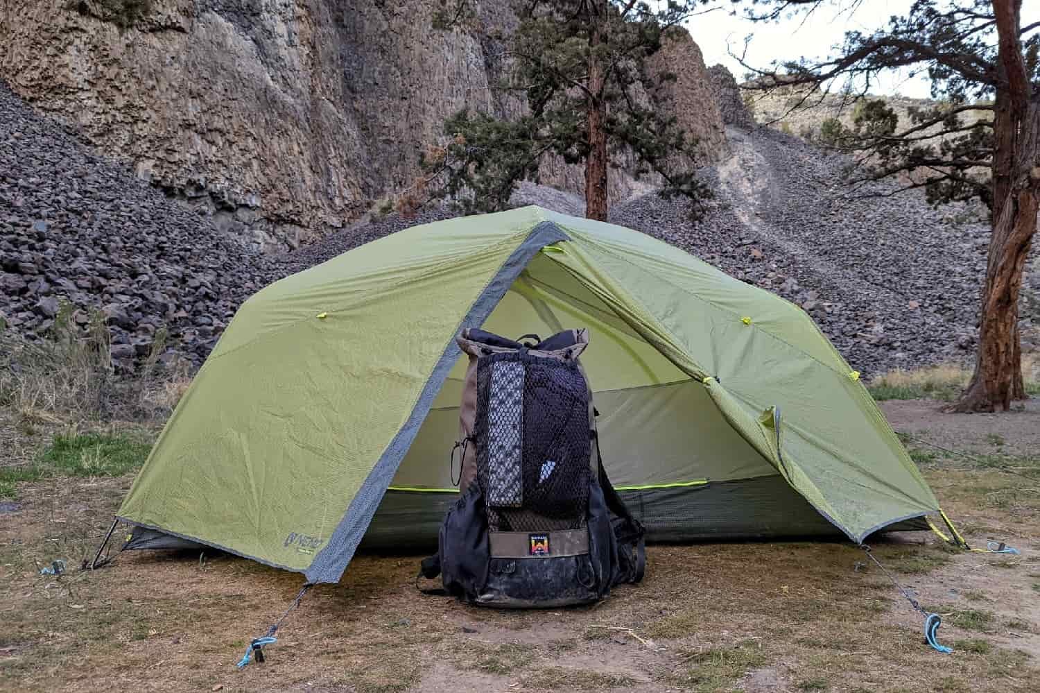 a backpack under the vestibule of the nemo dagger 2 osmo tent