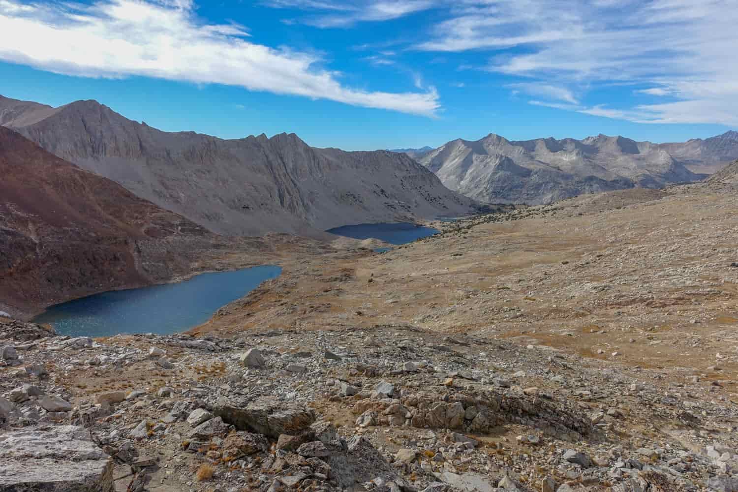 view of the basin below a mountain pass on the JMT