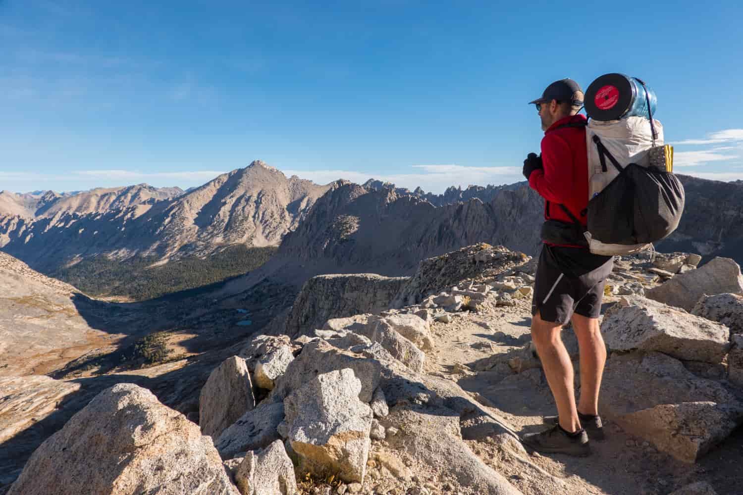 Backpacker overlooking mountains on a sunny day in California