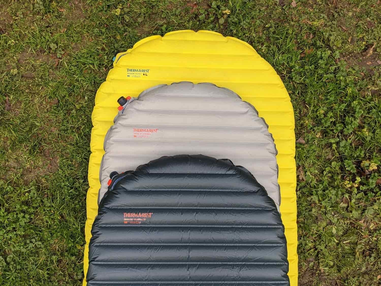 three varieties of therm-a-rest sleeping pads stacked on top of each other