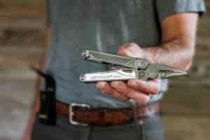 close up of a person holding the leatherman wave+
