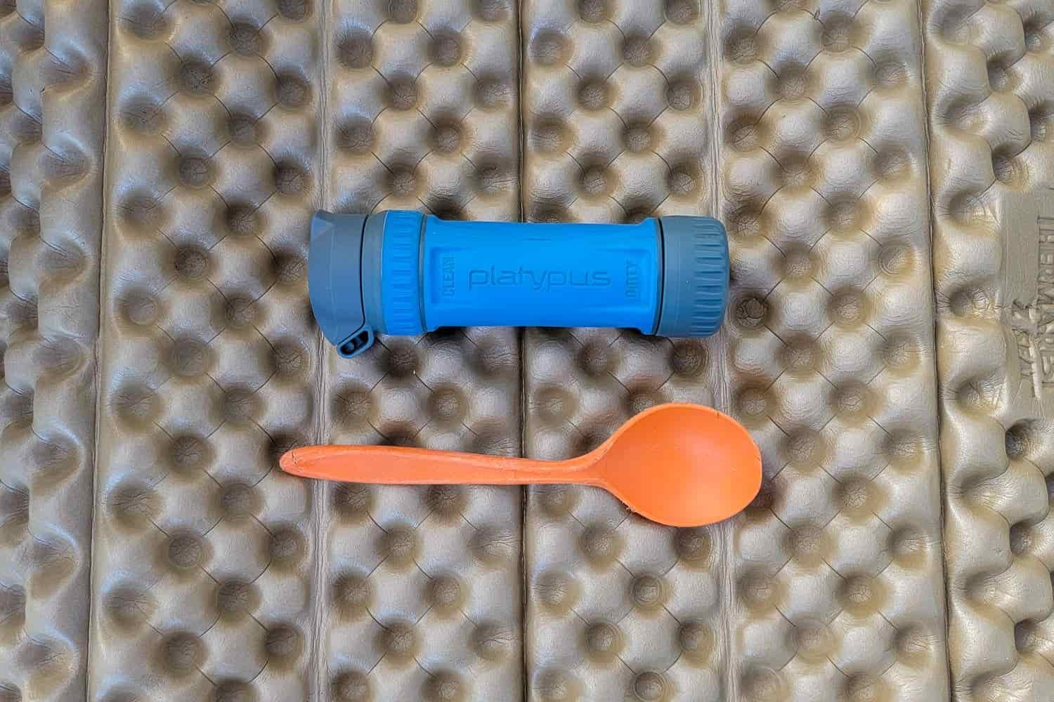 size comparison of a spoon next to the platypus quickdraw filter