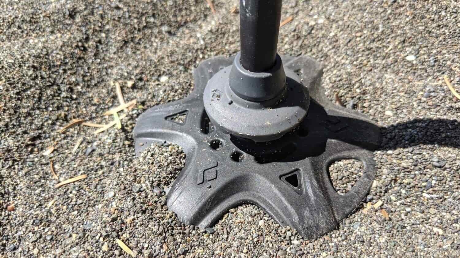 the basket that is secured to the bottom of a trekking pole prevents the pole from plunging through snow, mud and sand
