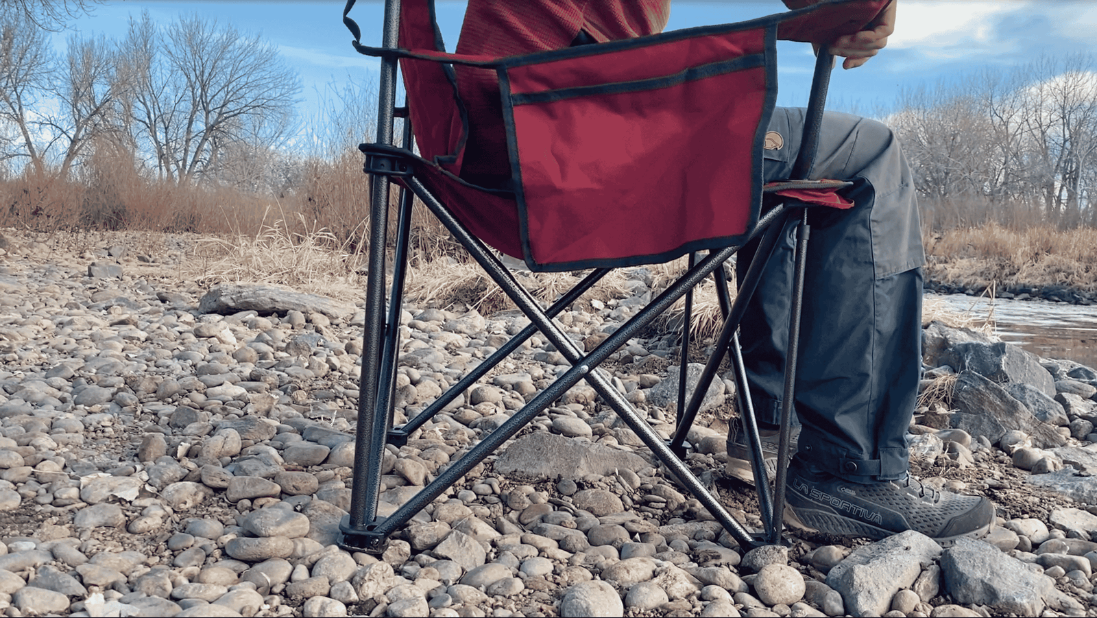 Close up of a person sitting in a chair from the side.