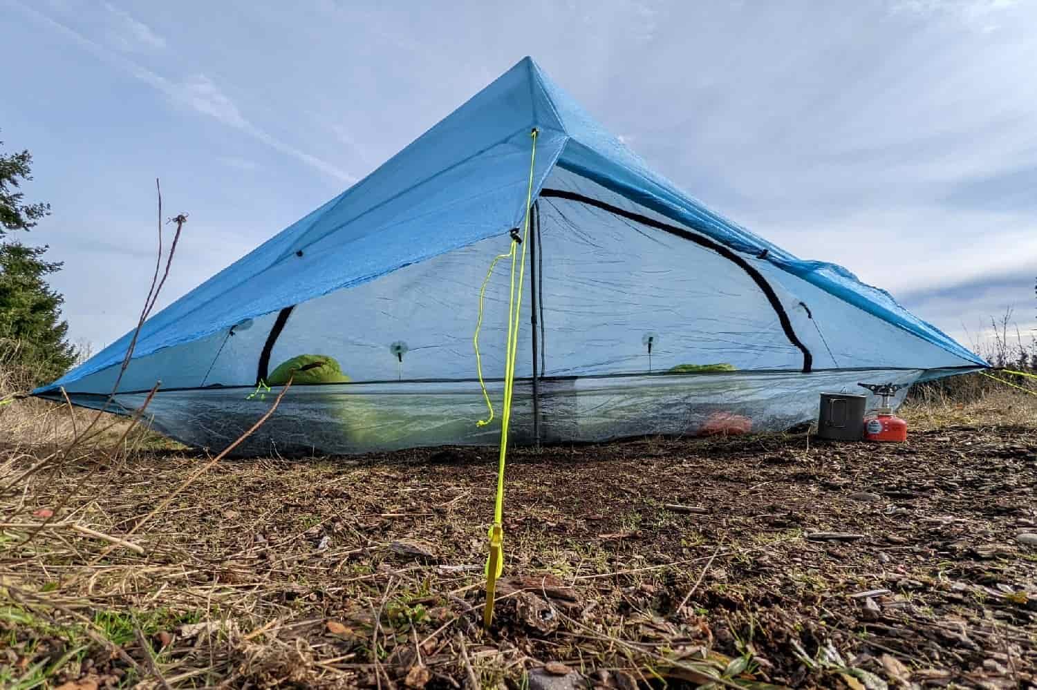 the zpacks plex solo pitched on a flat grassy meadow