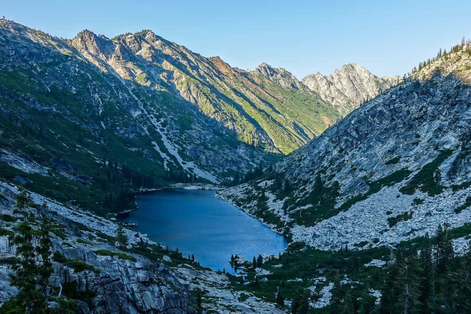 view from above a shaded alpine lake in the trinity alps