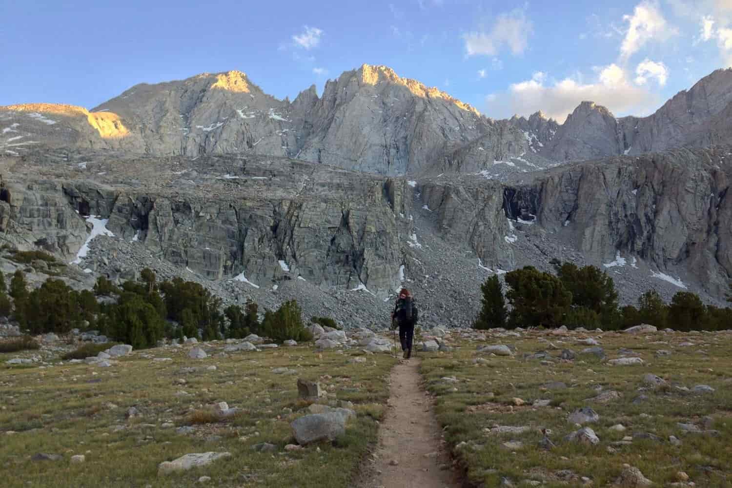 trail headed for the mountains with a thru-hiker walking
