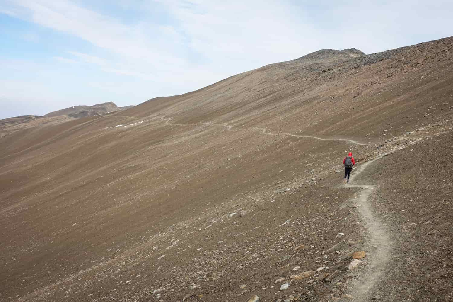 a vast slope of talus and a single scratched in trail traversing the slope in jasper national park on the skyline trail