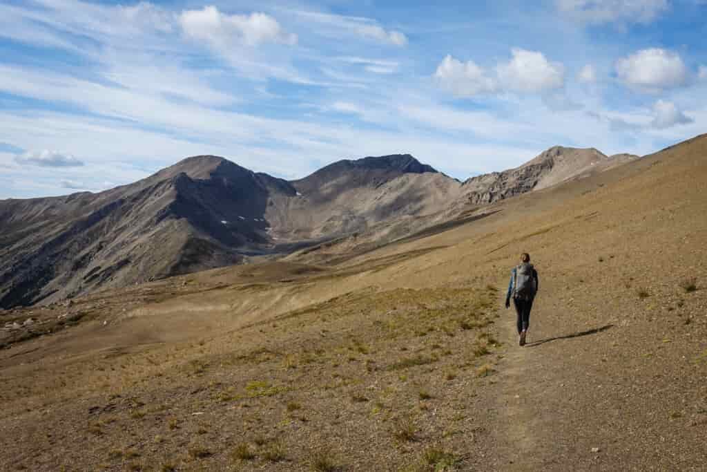 a backpacker walking on the skyline trail in jasper national park