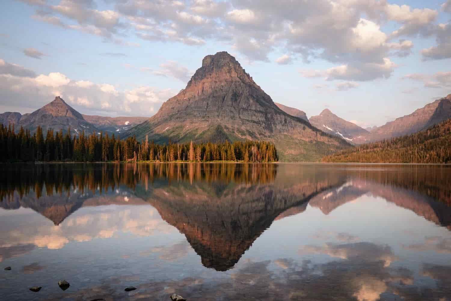 lake reflecting mountain in glacier national park