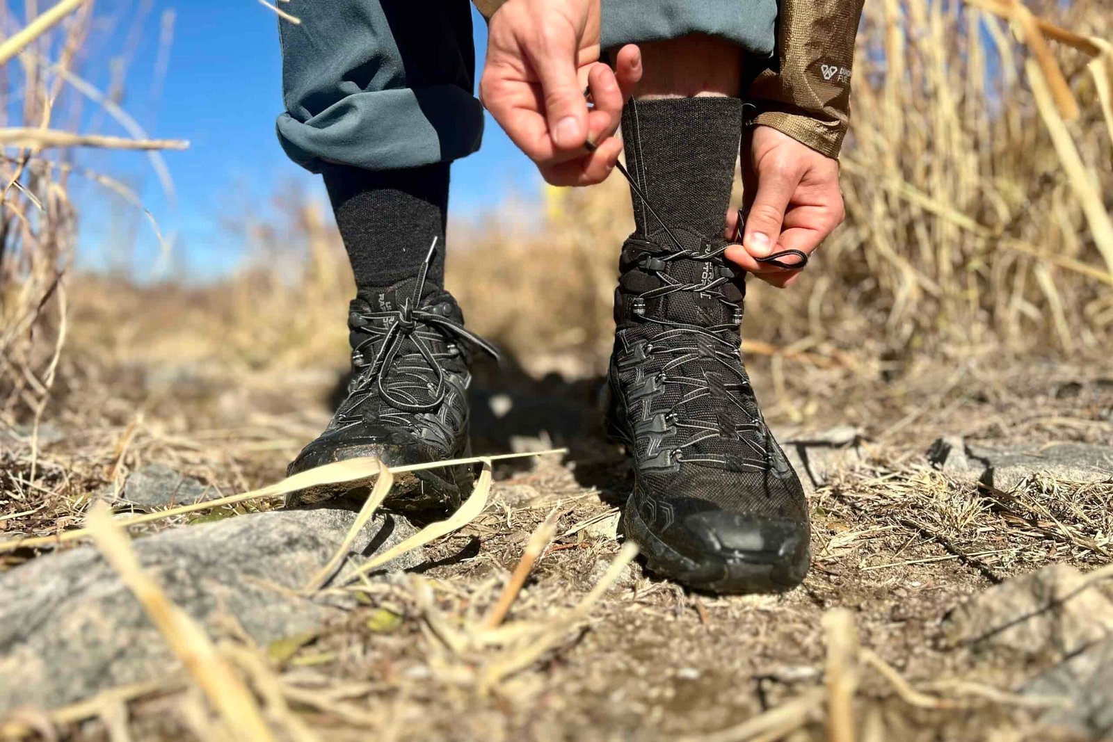 Close up of a person tying their boots.