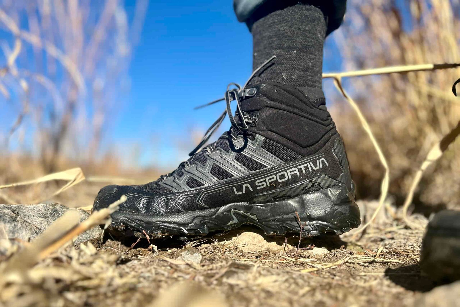 Close up image of a black hiking boot from the side.