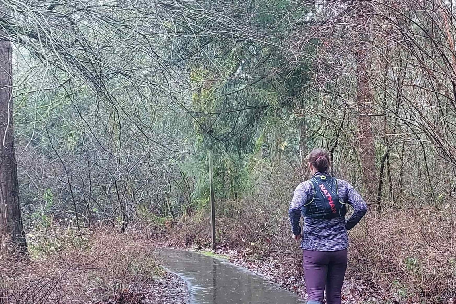 Runner wearing the Nathan Pinnacle 4 Hydration Race Vest