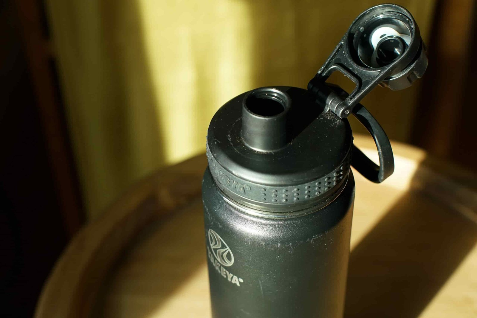 A close up of the narrow spout of the Takeya Actives Insulated water bottle.