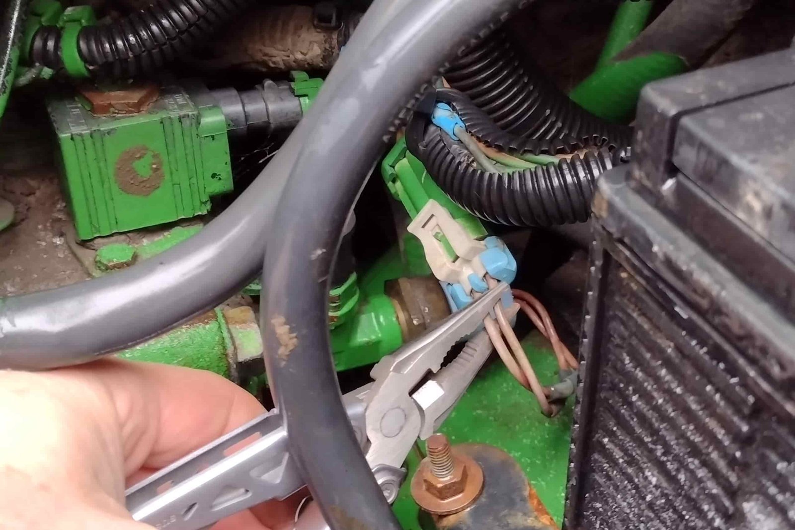 The Gerber Suspension NXT, gripping electrical wires in a John Deere tractor.