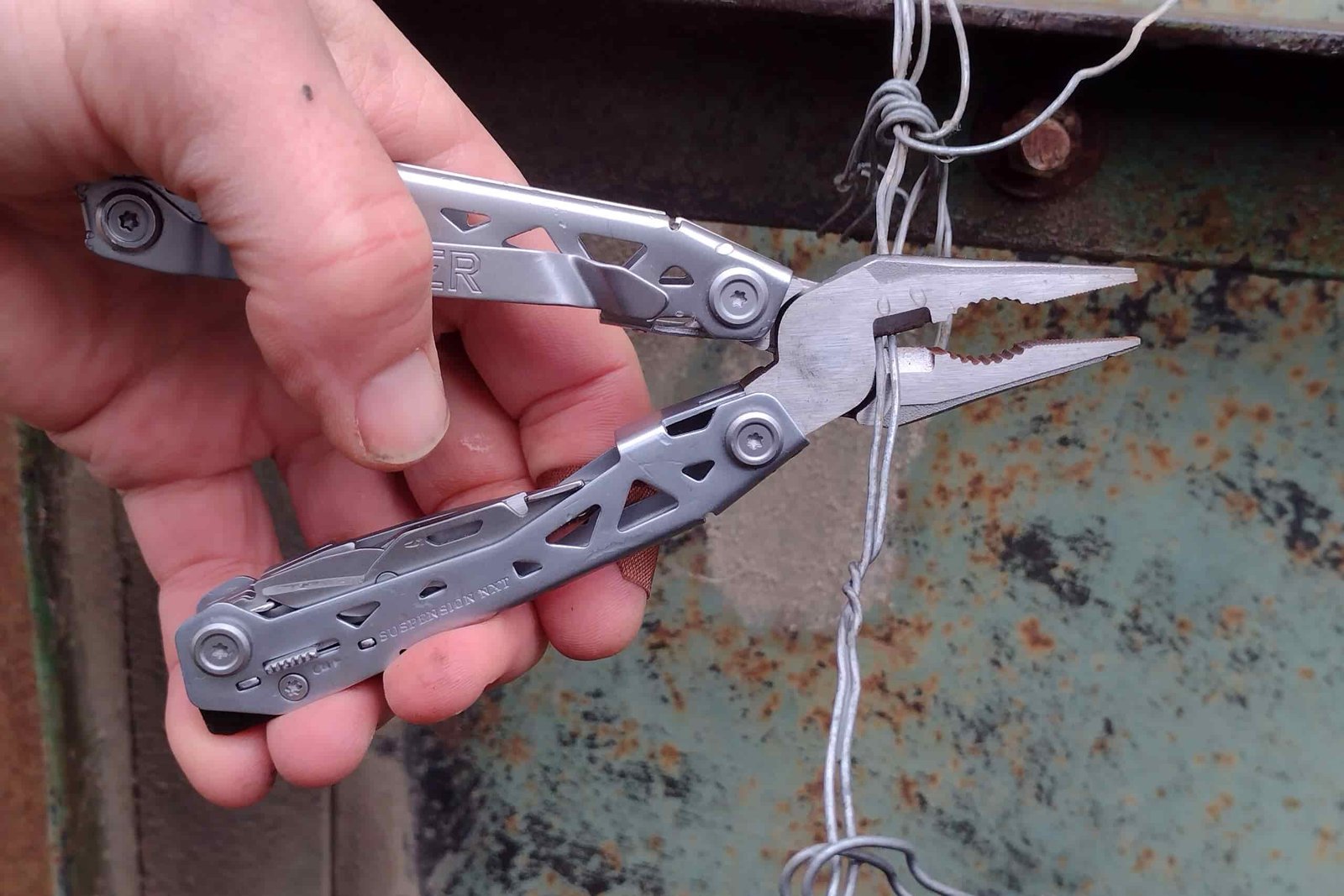 The silver Gerber Suspension NXT cutting wires with its wire cutters
