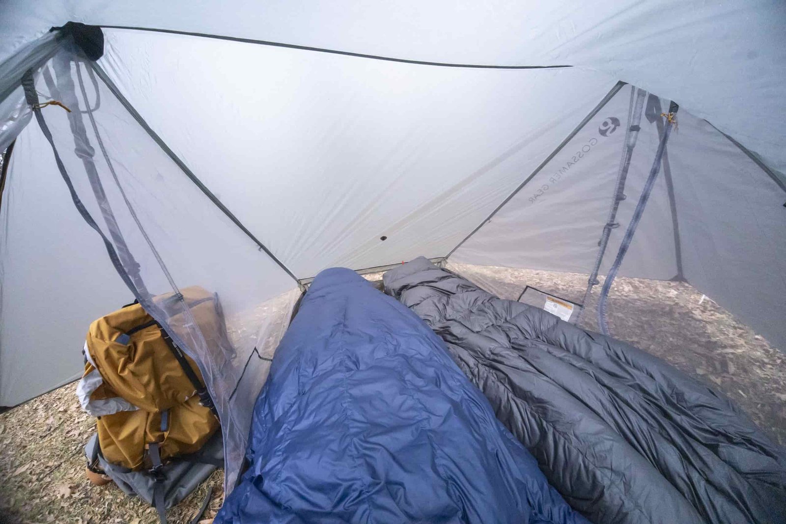two sleeping bags inside a two person trekking pole tent