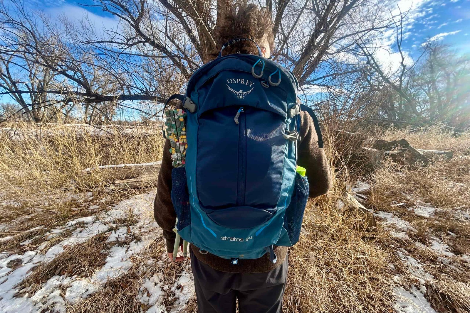 Close up of a person wearing a backpack.
