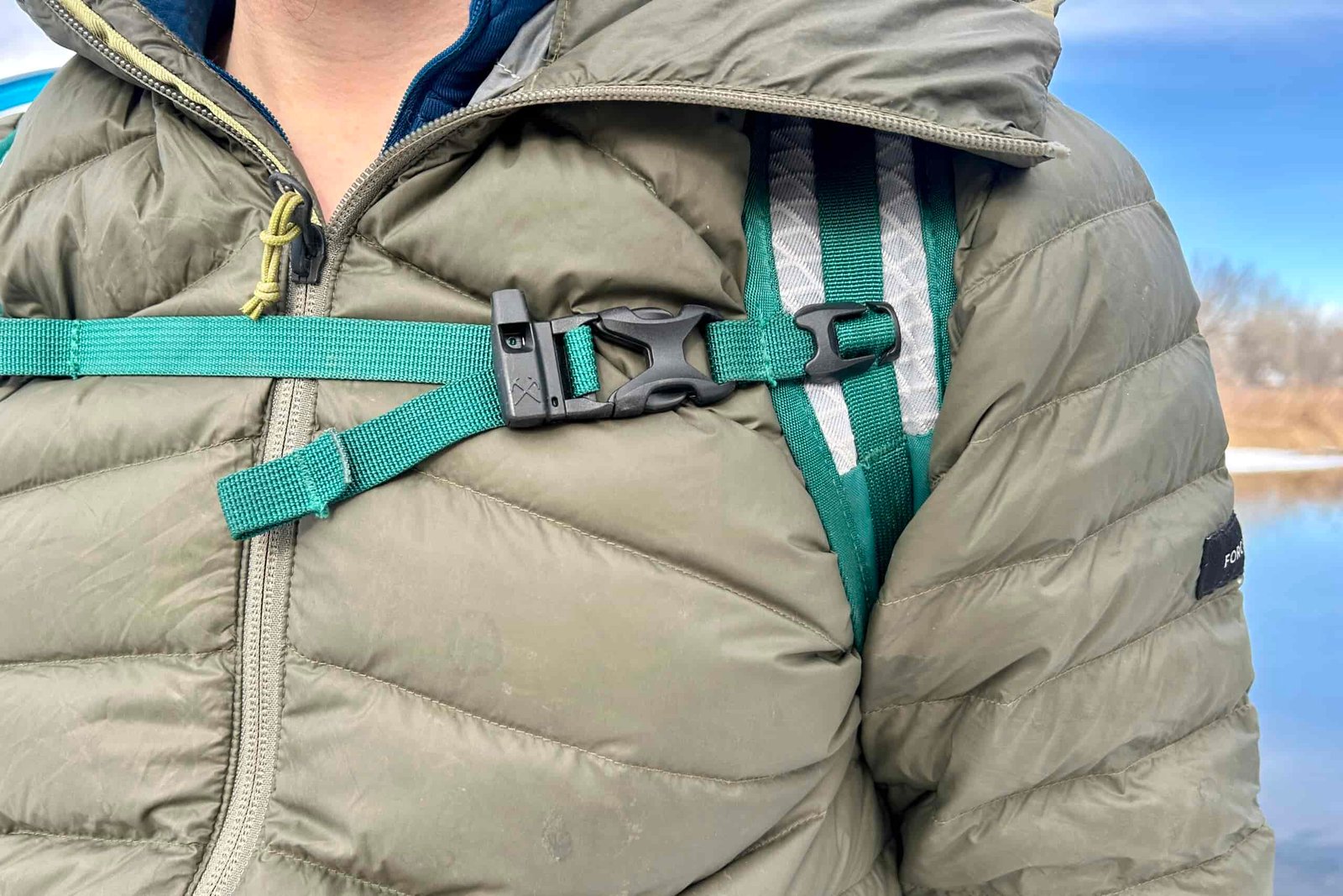 Close up of the shoulder and sternum straps of a daypack.