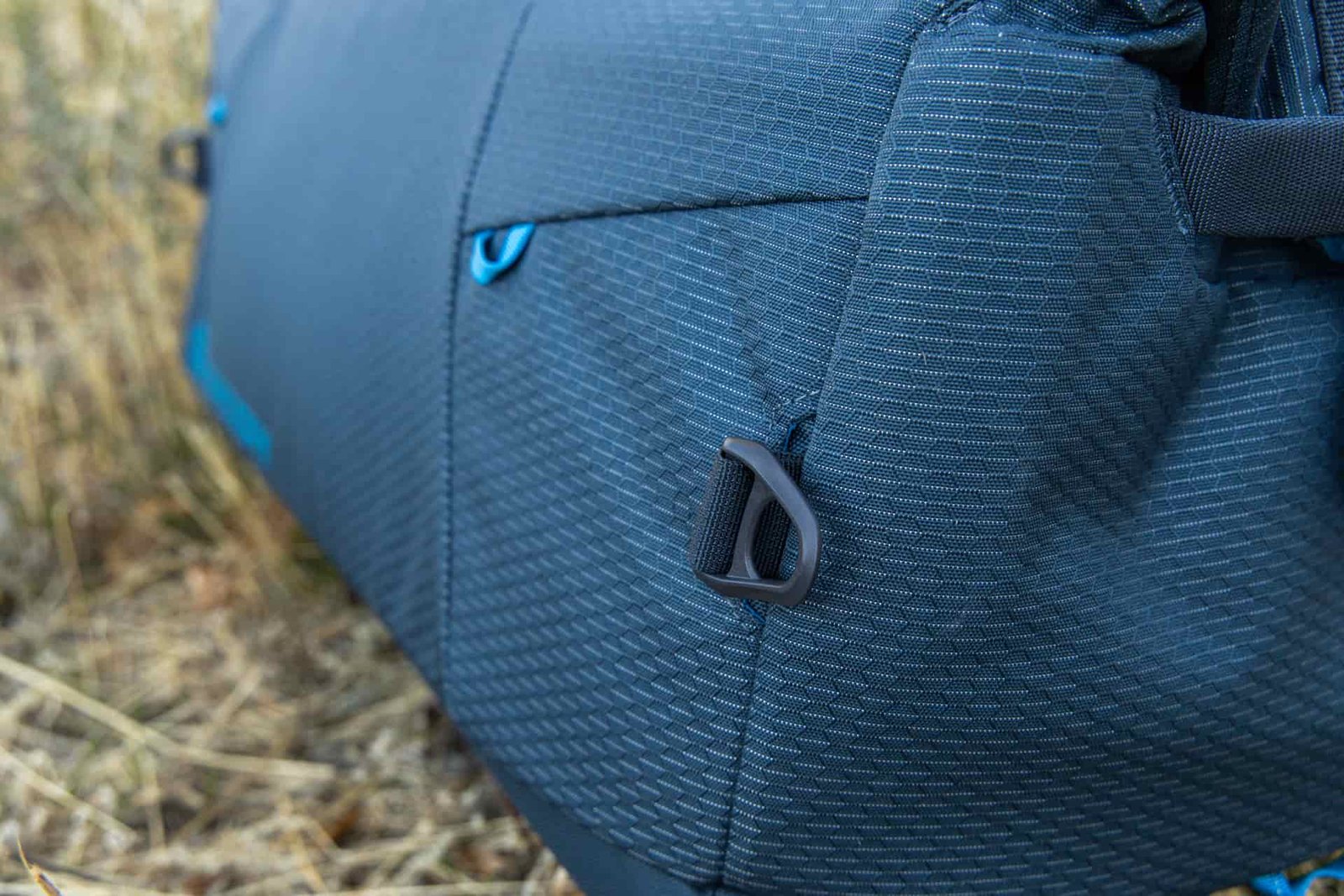 A close-up of the durable rings for clipping on the removable shoulder strap.