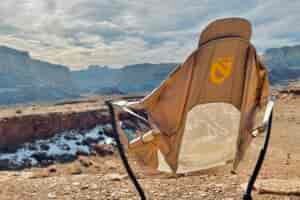 A camping chair from behind in a sunny desert setting.