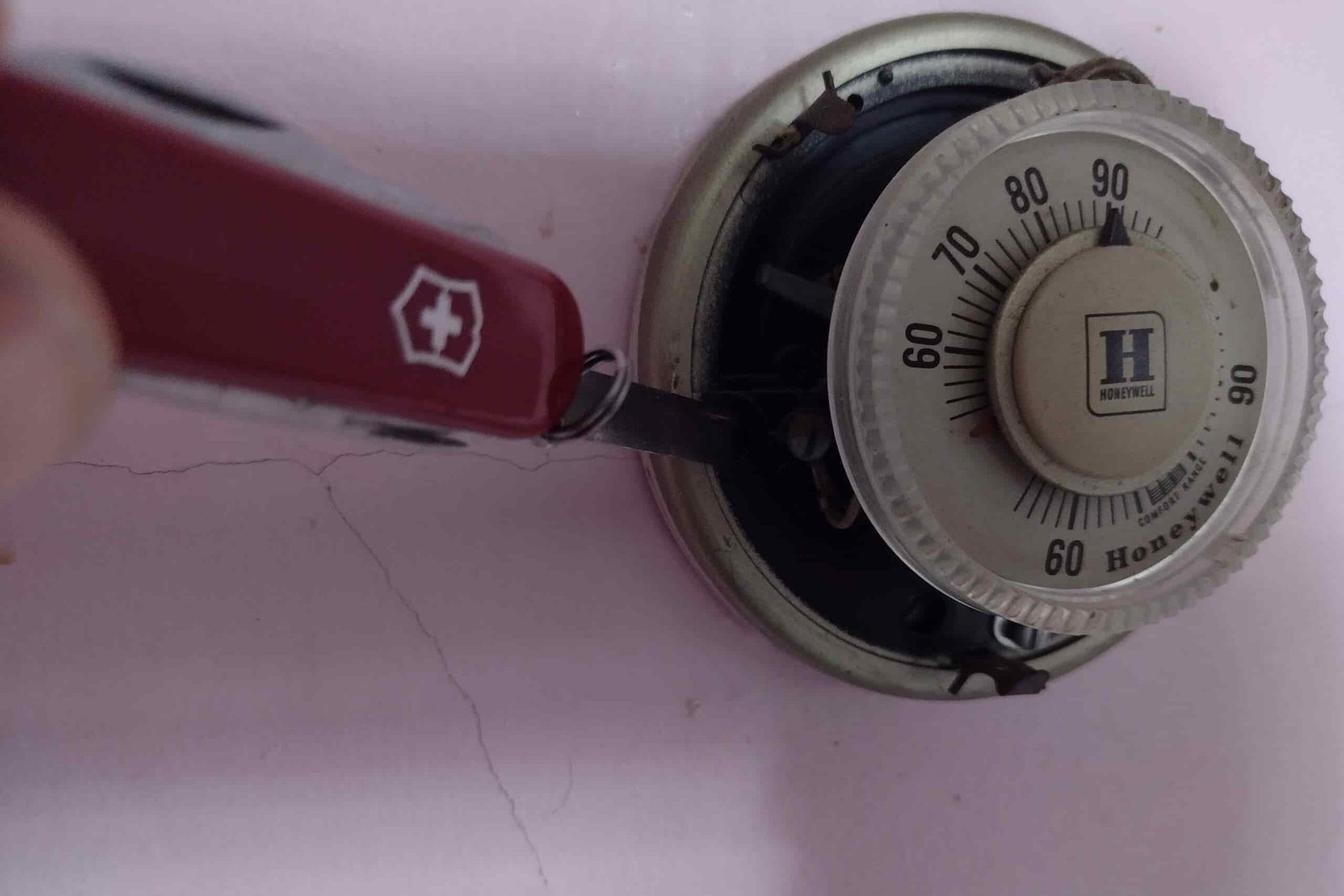 The Victorinox Rambler repairing a home thermostat.