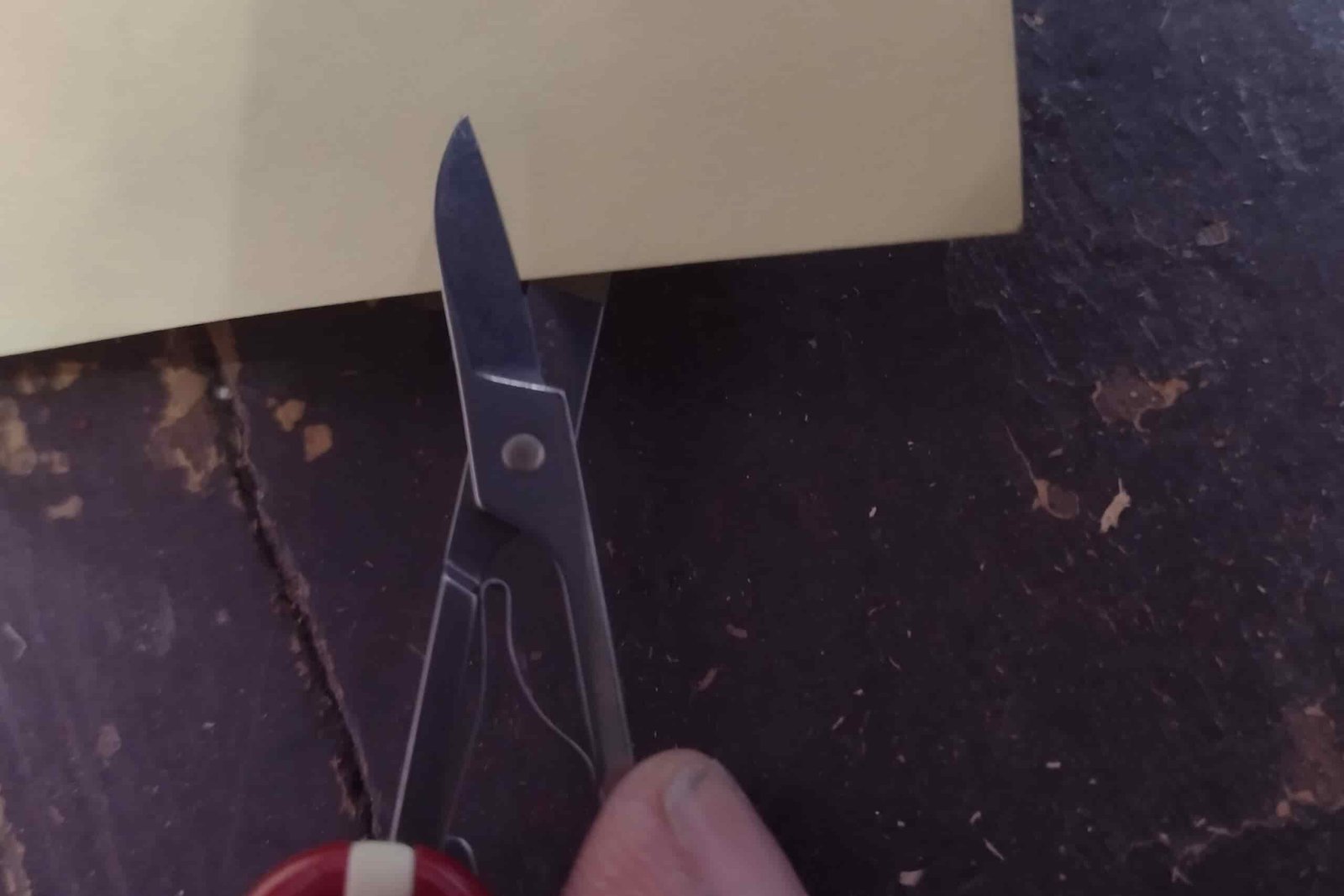 The Victorinox Rambler cutting a sheet of paper.
