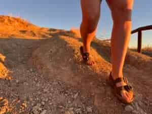 Our tester wearing the Astral Webber sandals on a hike.