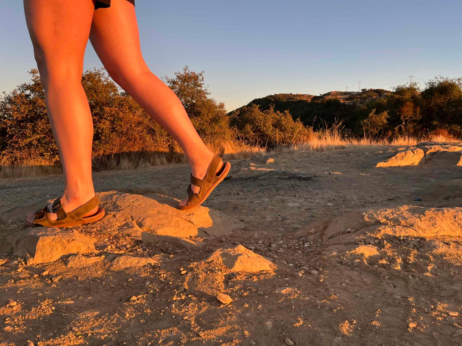 Our tester wearing the Astral Webber sandals on a hike.