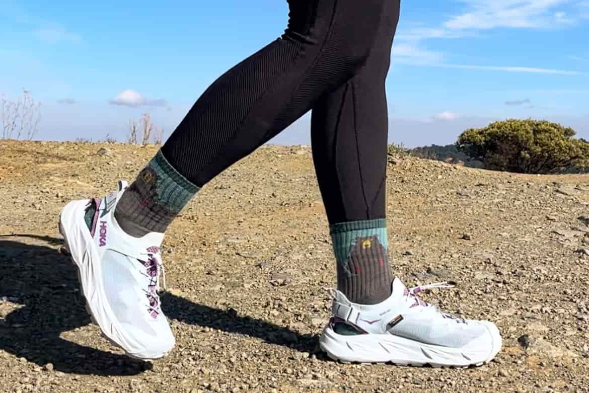 Our tester wearing the HOKA Hopara 2 sandals on a hike.