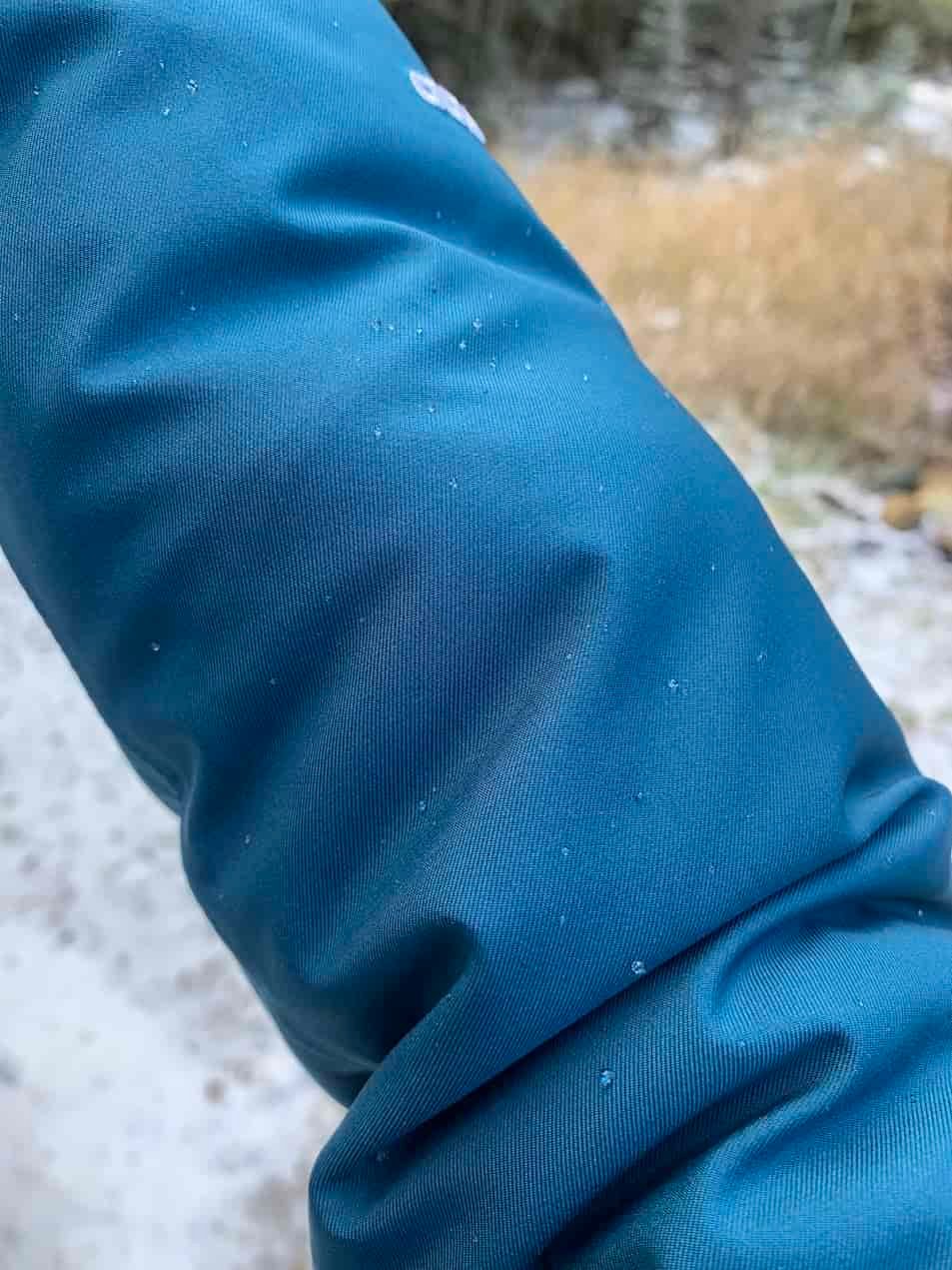 droplets forming on the arm of the north face arctic waterproof winter jacket