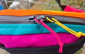 a view of the top of the roo by atom packs showing the zippers and zipper pulls