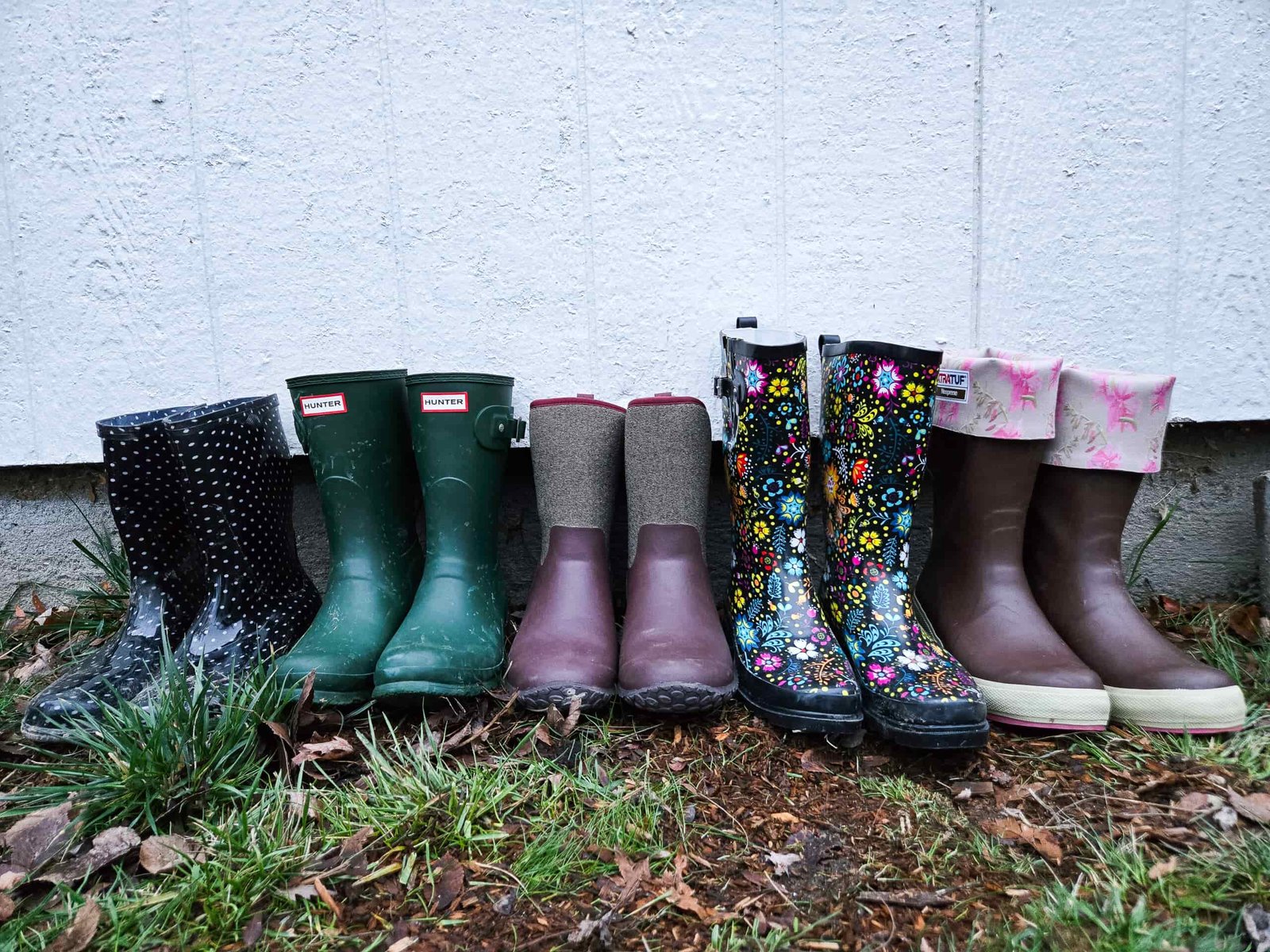 a lineup of many pairs of the best rain boots we tested this year