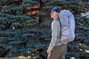 a man wearing a white backpack