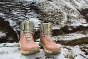 Pair of Women’s Altra Lone Peak ALL-WTHR 2 hiking boots on a snowy hillside