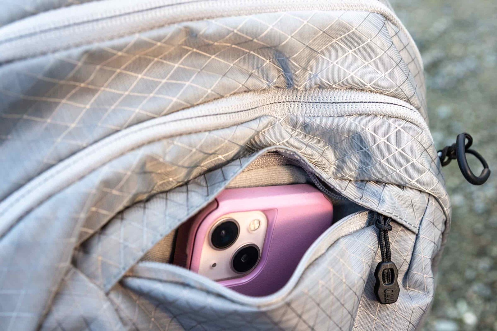 Details of CamelBak H.A.W.G. Pro 20 100oz - a phone in the exterior small pocket