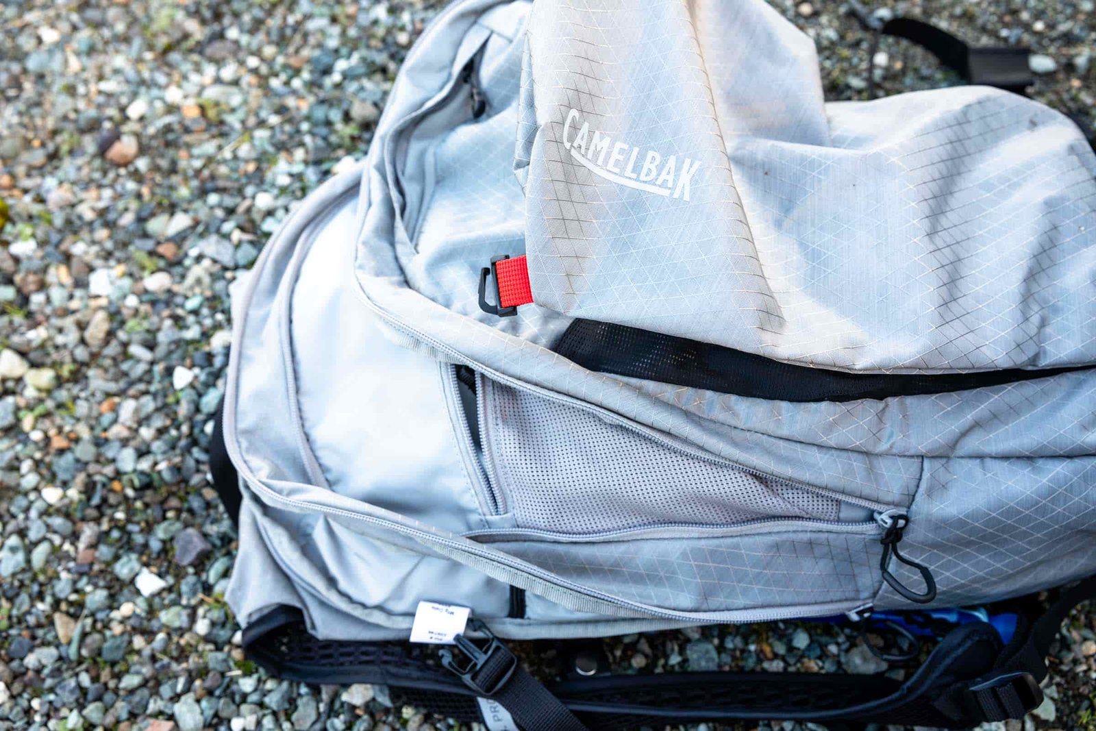 Details of CamelBak H.A.W.G. Pro 20 100oz - side view of the pack with all the compartments open and shown