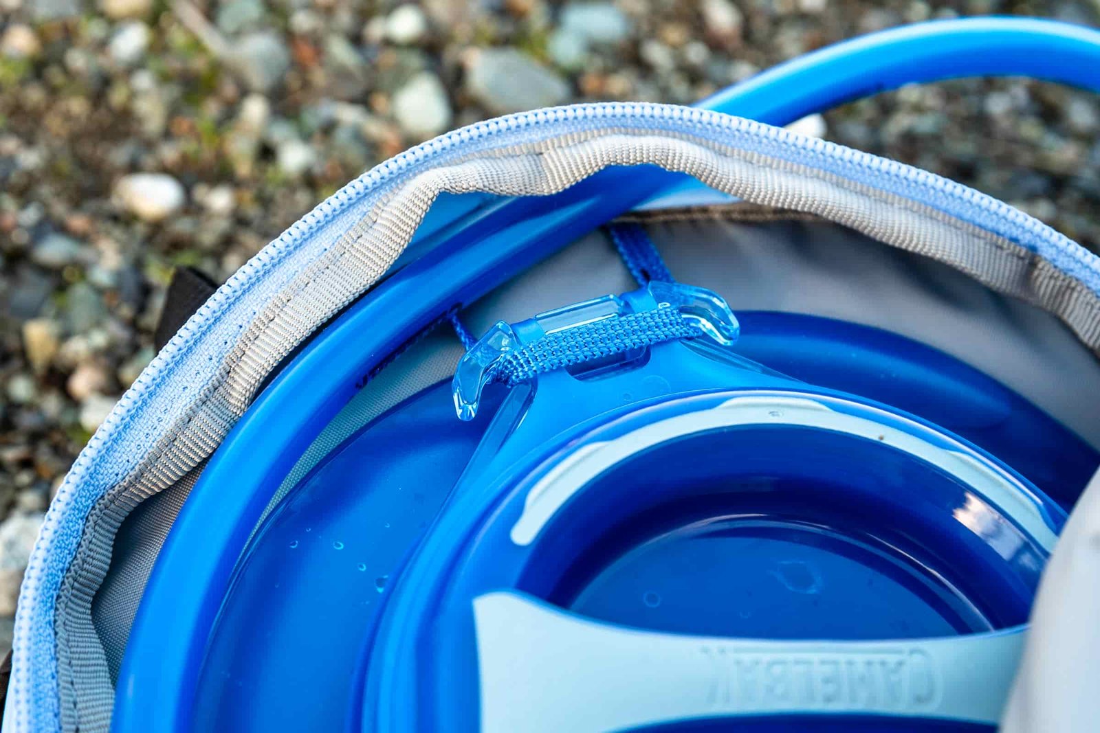 Details of M.U.L.E.® 12 Hydration Pack 100 oz - a close up view of the bladder connection to the pack