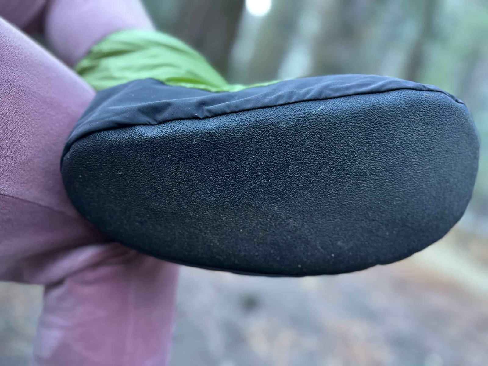 a green down bootie at camp