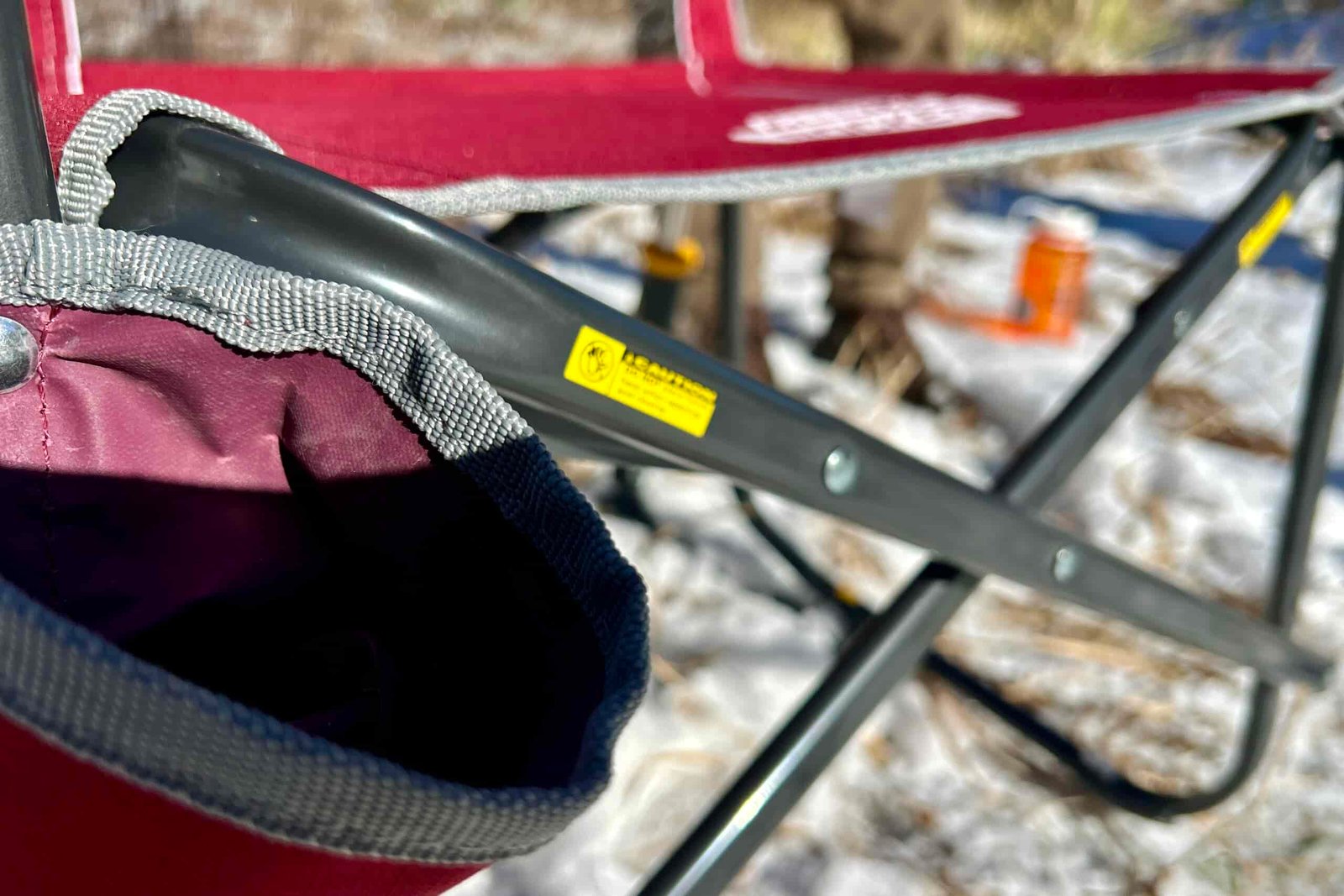 Close-up of the frame and fabric and stitching on a camping chair.