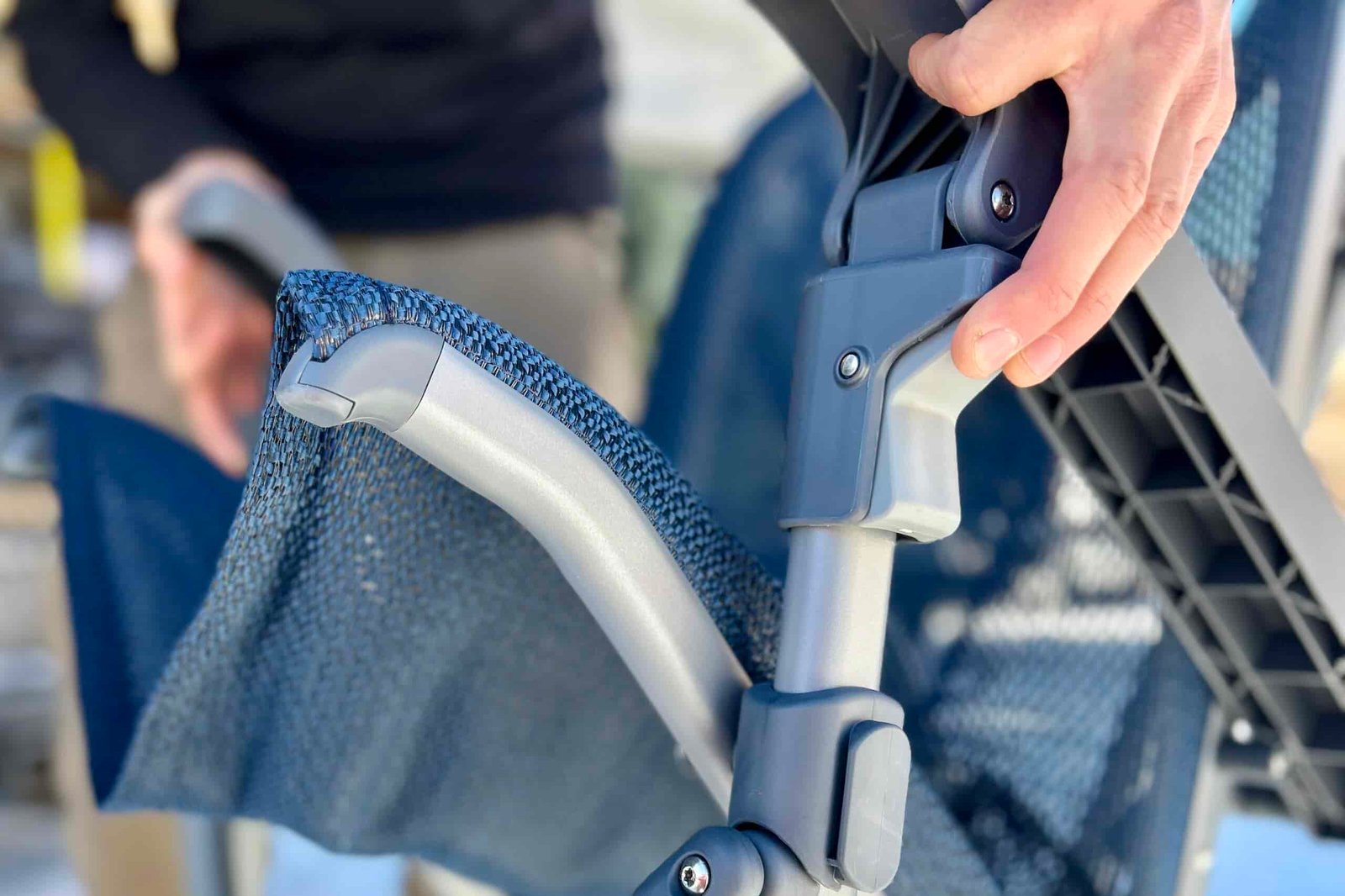 Close up of a button used to collapse a camping chair.