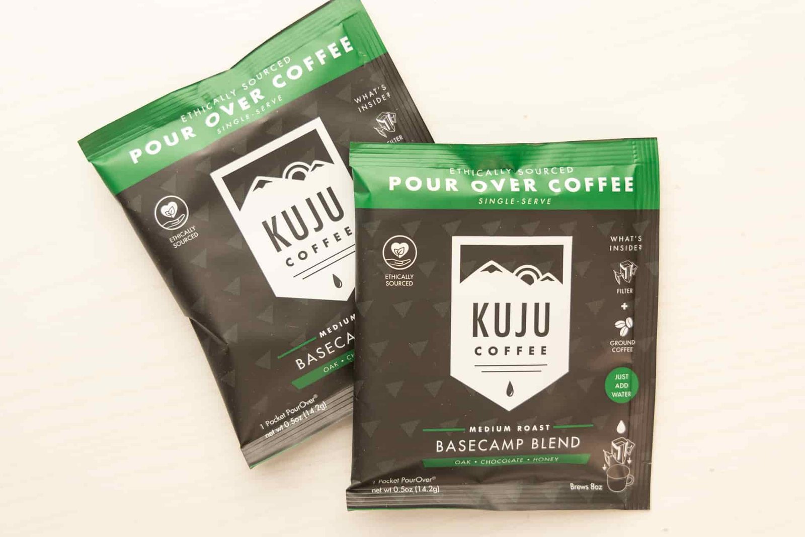 Two Kuju Single-Serve Pour-Over packets.