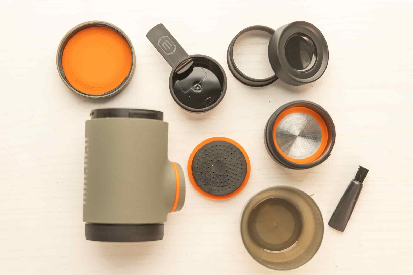 The many parts of the Wacaco Minipresso disassembled.
