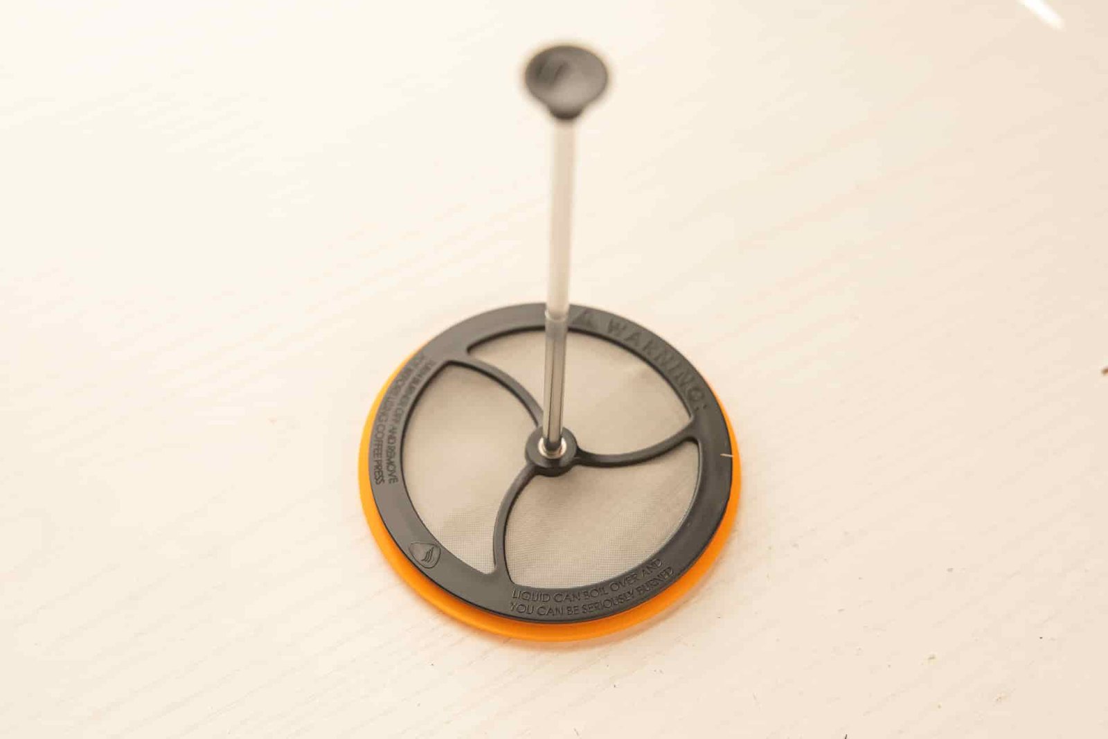 The Jetboil Silicone Coffee Press accessory consists of a lid, filter, and plunger.
